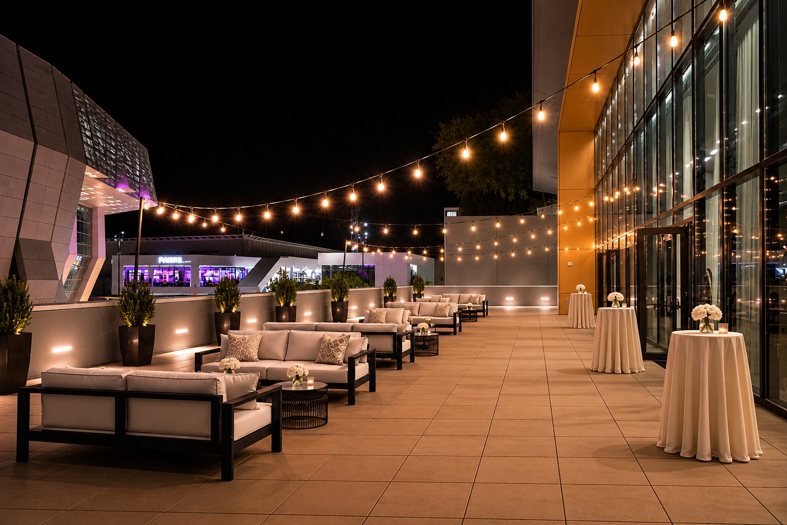 Outdoor terrace with string lights at the Kimpton Sawyer Hotel